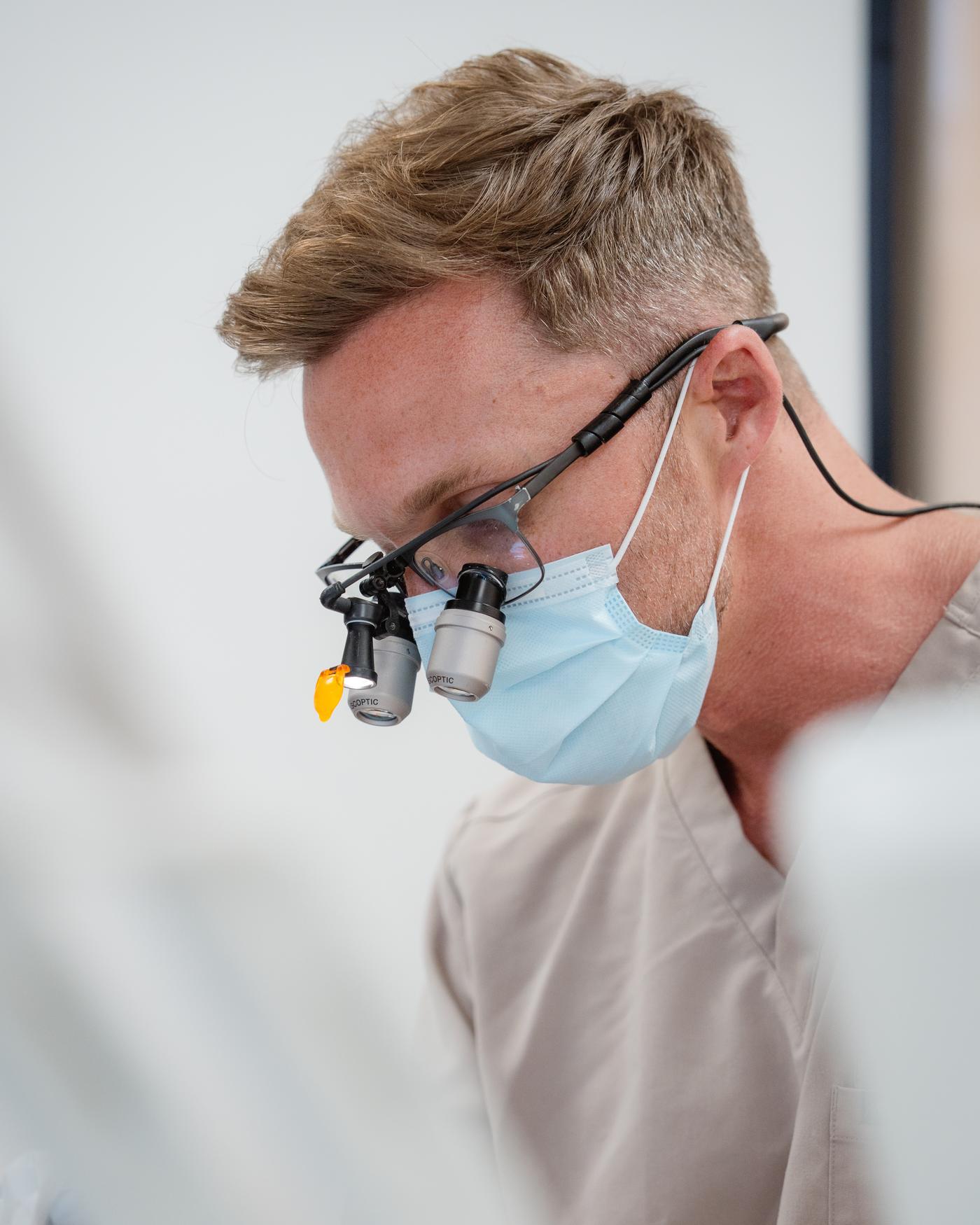 Dr Matt Hedge treating a patient at Helix Dental, Mermaid Waters